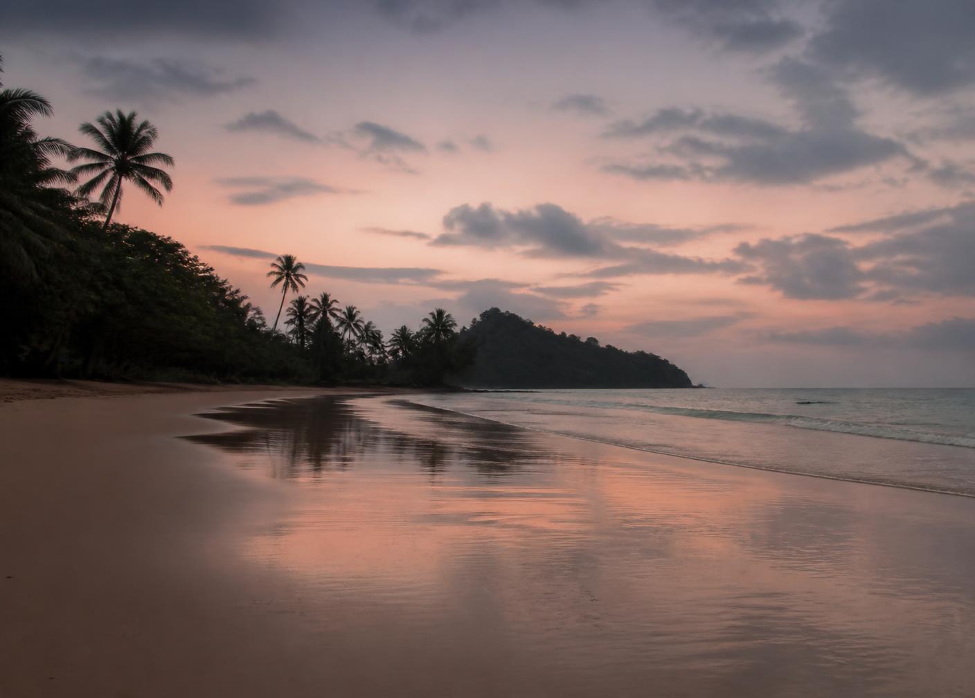 Empty tropical beach at dawn with soft pink light