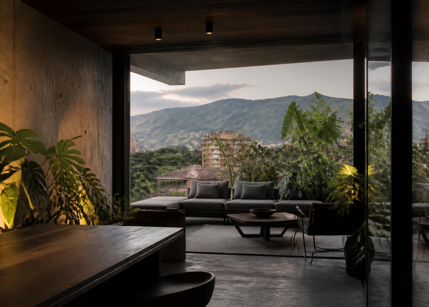 Medellín apartment terrace with mountain views and tropical planting